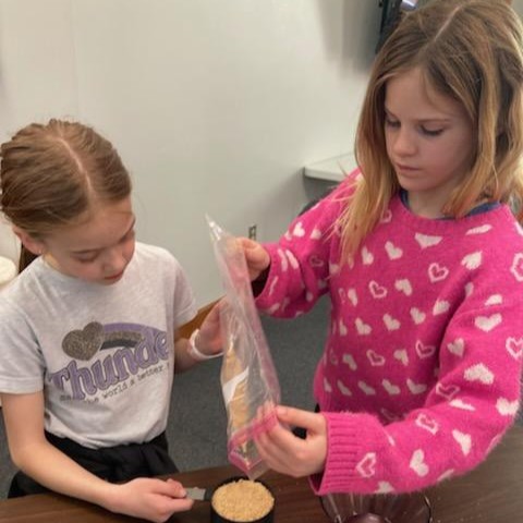 Participants measure crushed graham crackers.