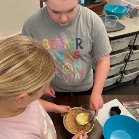 Participants mix ingredients.