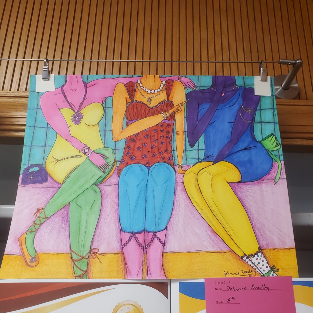Illustration depicts three boldly dressed female figures sitting on a bench together in positions that suggest close friendship. Artist: Johnnie Bradley. "Colorful Sisterhood."