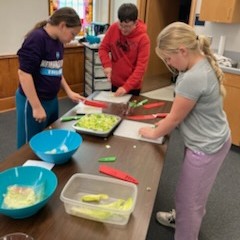 Participants chop vegetables.