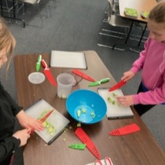 Participants chop vegetables.