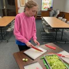 Participant chops vegetables.