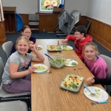 Participants enjoy finished salads.