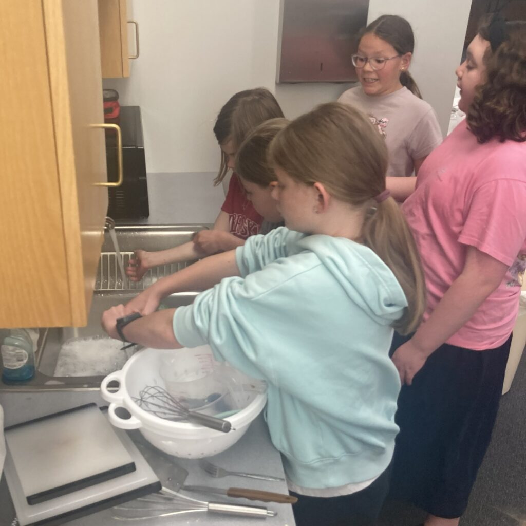 Participants washing dishes.