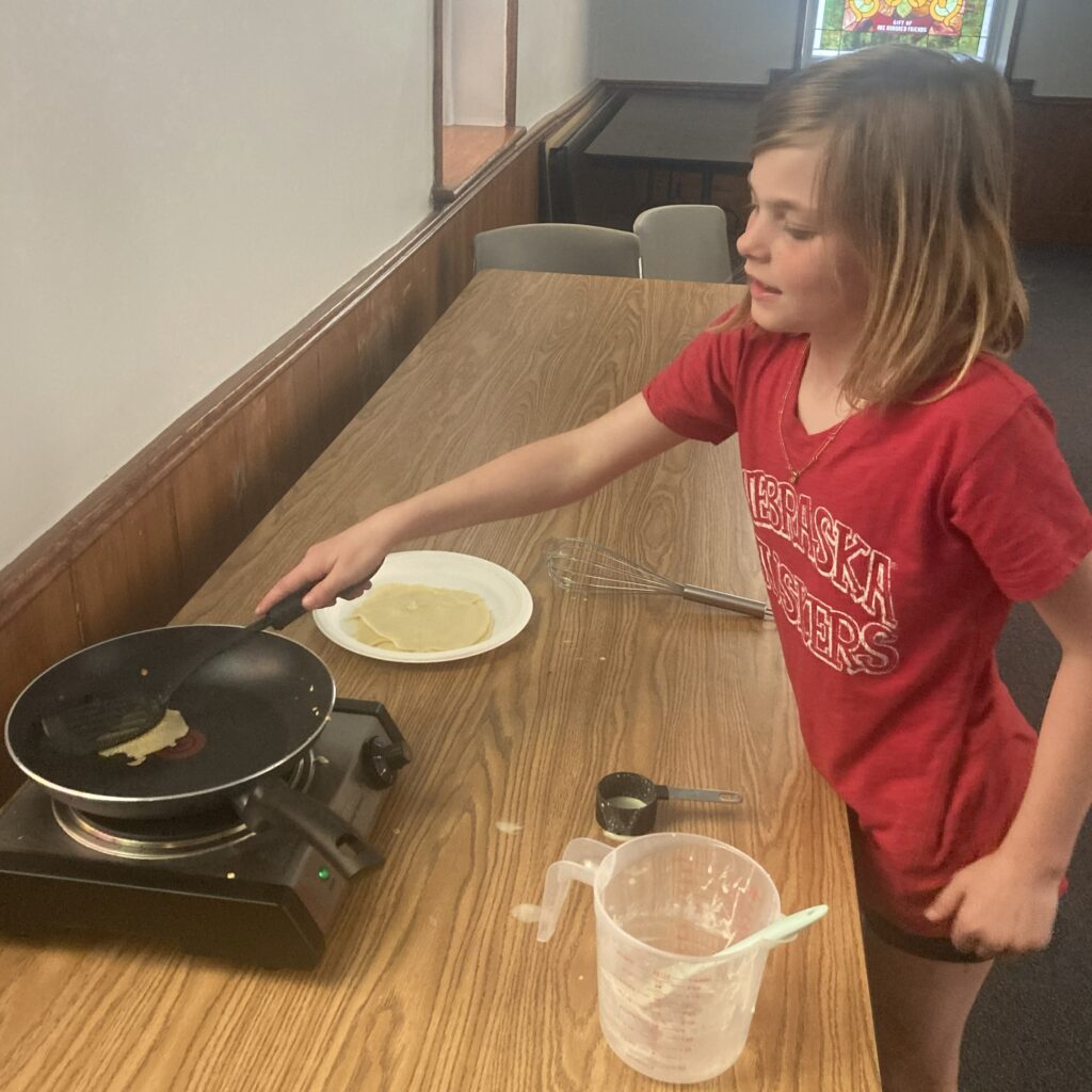 Participant prepping her pan for another crepe.