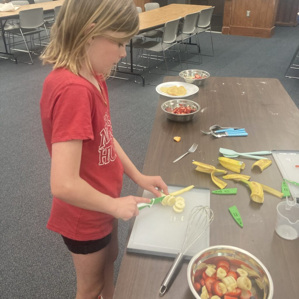 Participant slicing a banana.