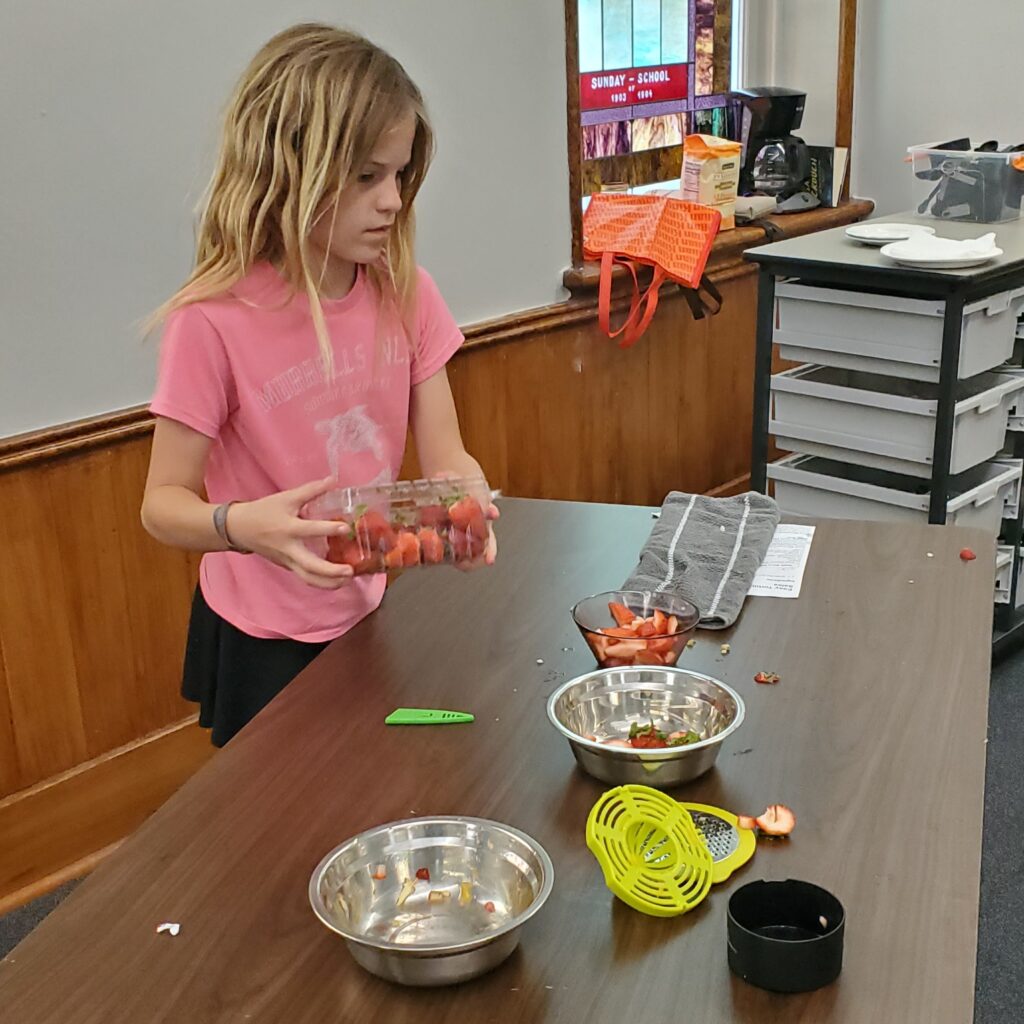 Preparing strawberries.