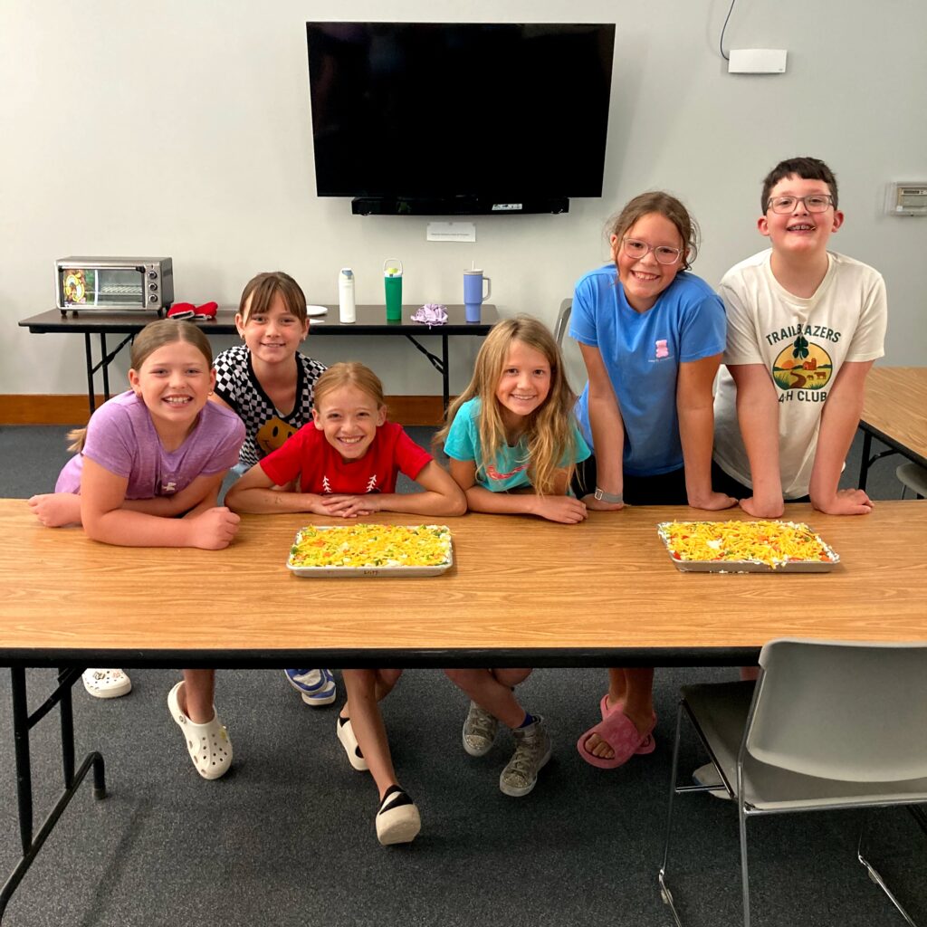 Cooking with Kids crew and their finished veggie pizzas.