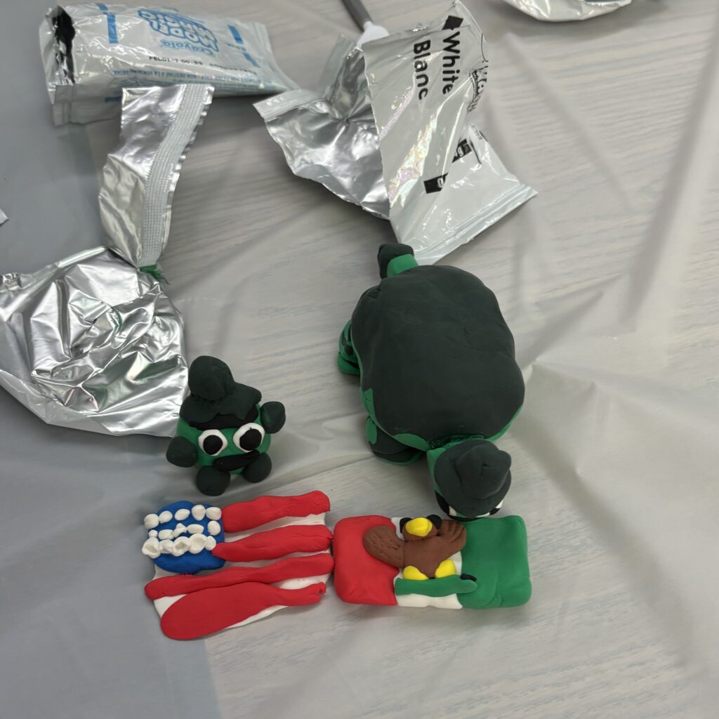 Assorted figures in clay.