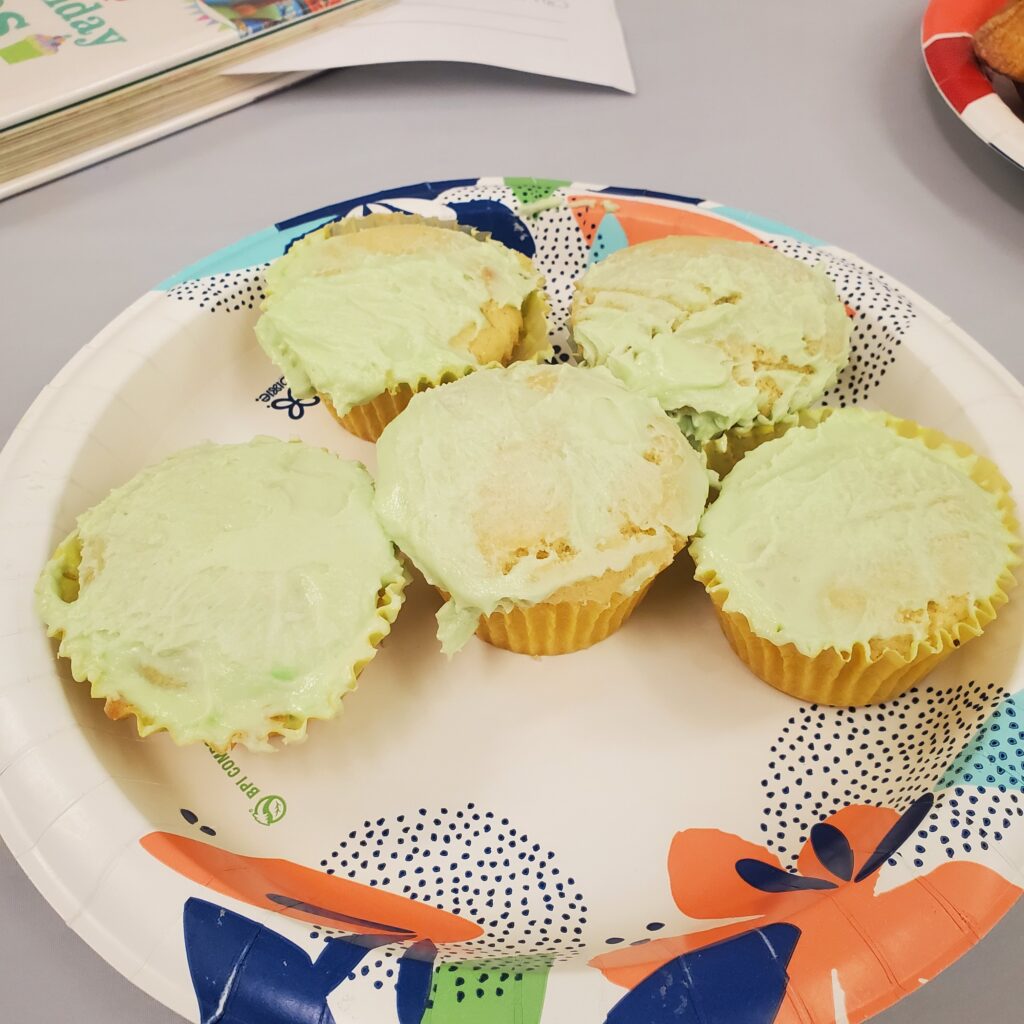 Colored frosting cupcakes with lime frosting.