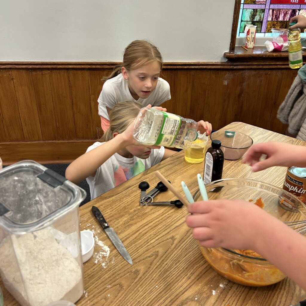 Kids measuring ingredients.